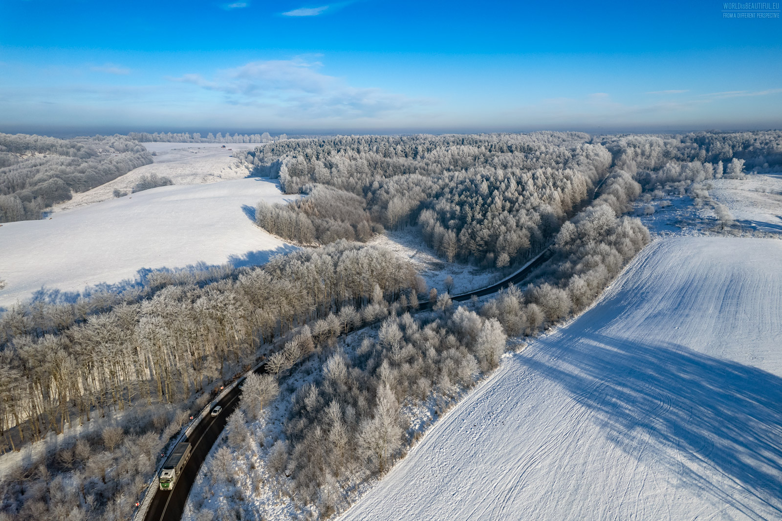 Snow-covered fields and forests
